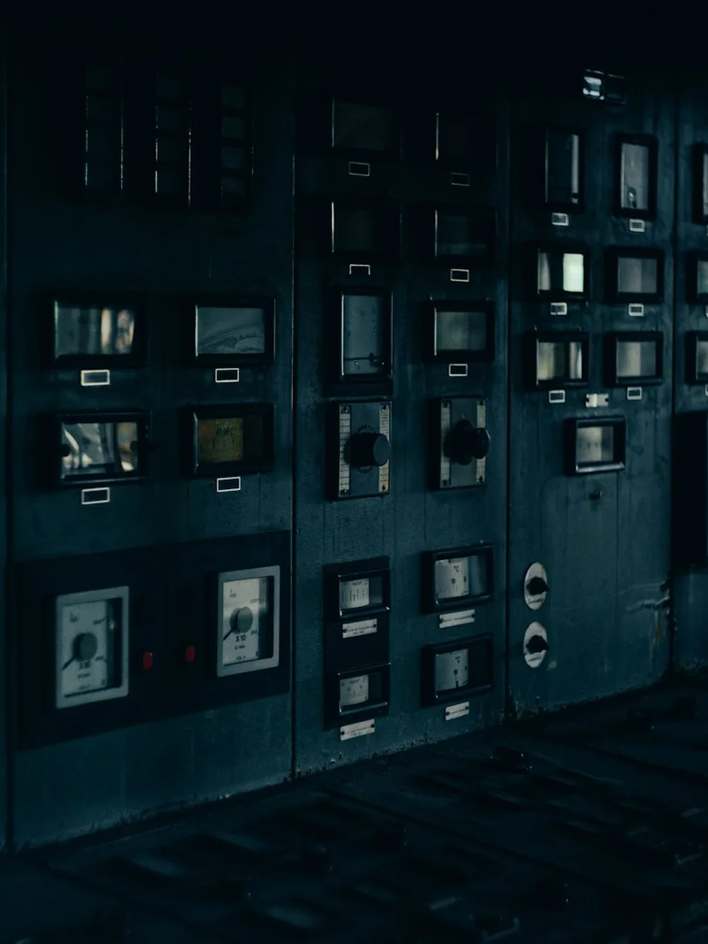 A dim room lined with instrument panels